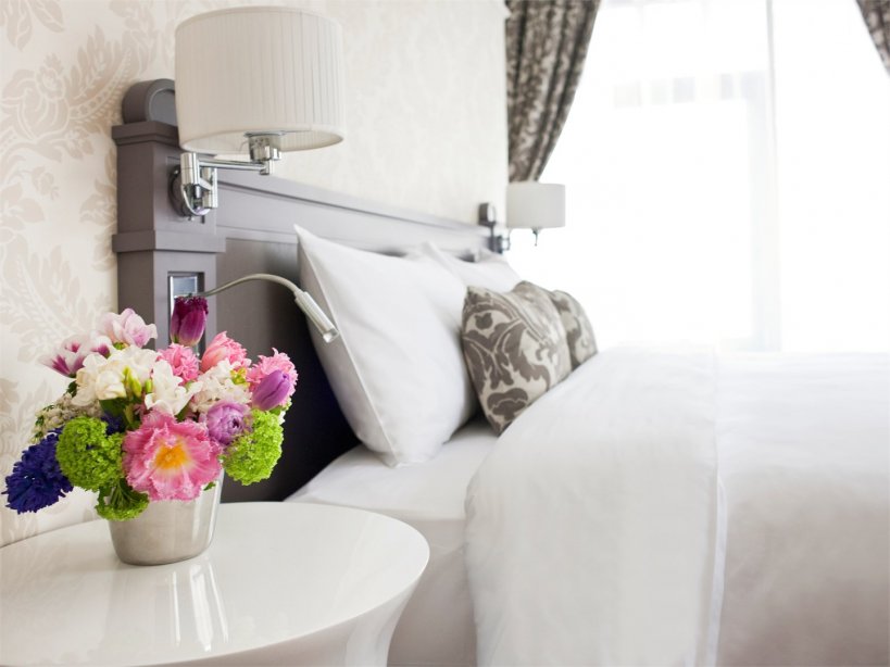 Suite with a large double bed and sofa, with a summer terrace