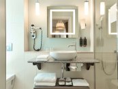Family Suite with a large double bed and sofa: Photo 4