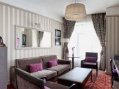 Family Suite with a large double bed and sofa: Photo 4